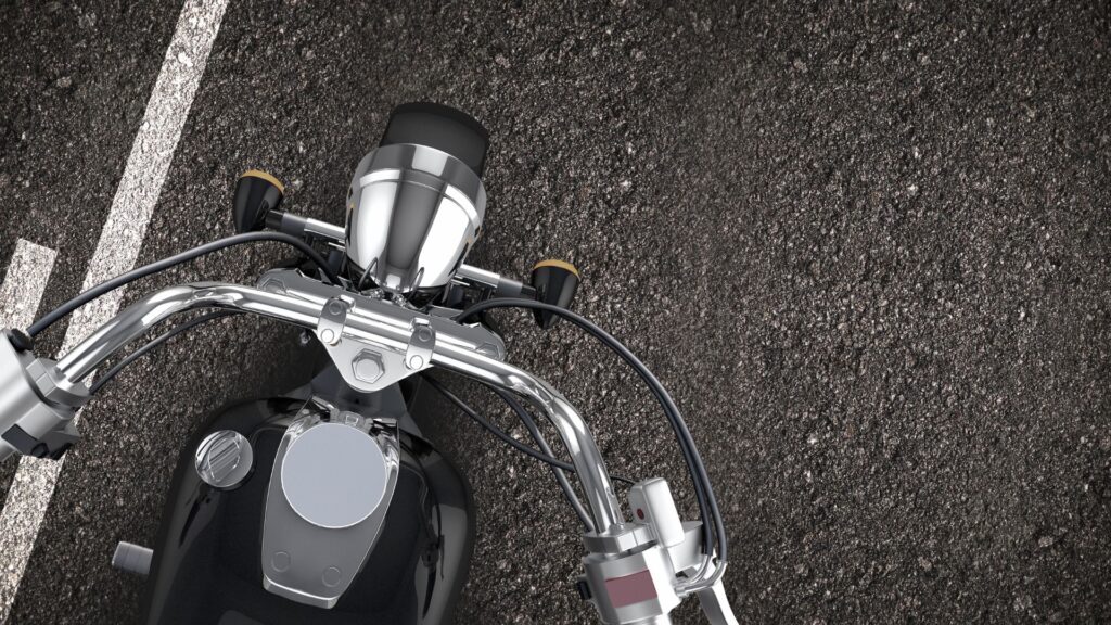 An overview shot of a motorcycle on a road.