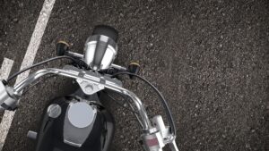 An overview shot of a motorcycle on a road.