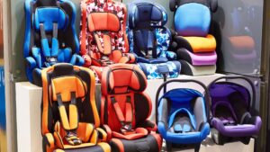 Two rows of colorful booster seats.