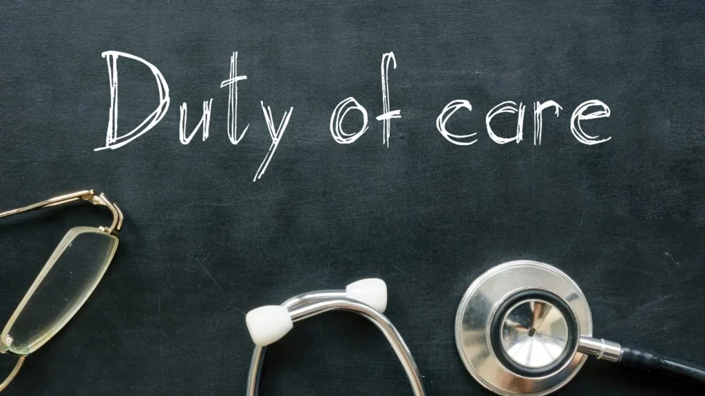 A chalk board with the phrase "Duty of Care" written with a pair of glasses and a stethoscope.