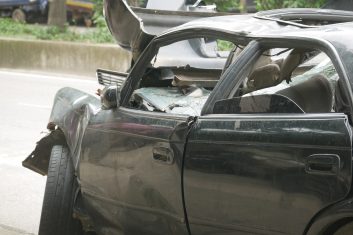 black car damaged by a road accident black car damaged by a road accident .